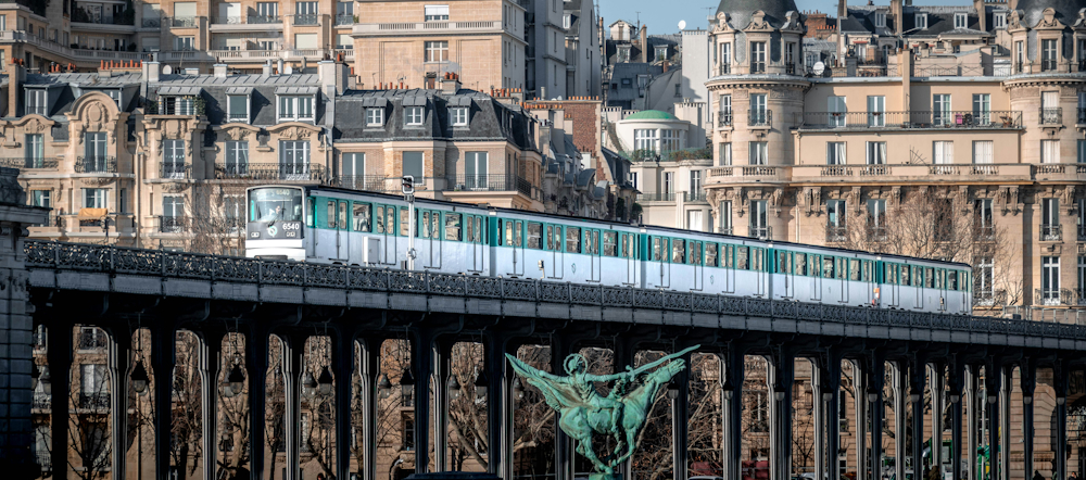 Paris Métro Train on the Pont de Bir‑Hakeim by Louis Paulin on Unsplash