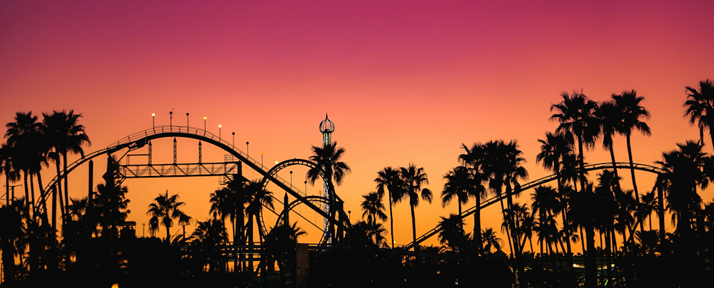 Roller Coaster and Palm Trees Against a Sunset Sky in Phoenix by iStrfry, Marcus on Unsplash