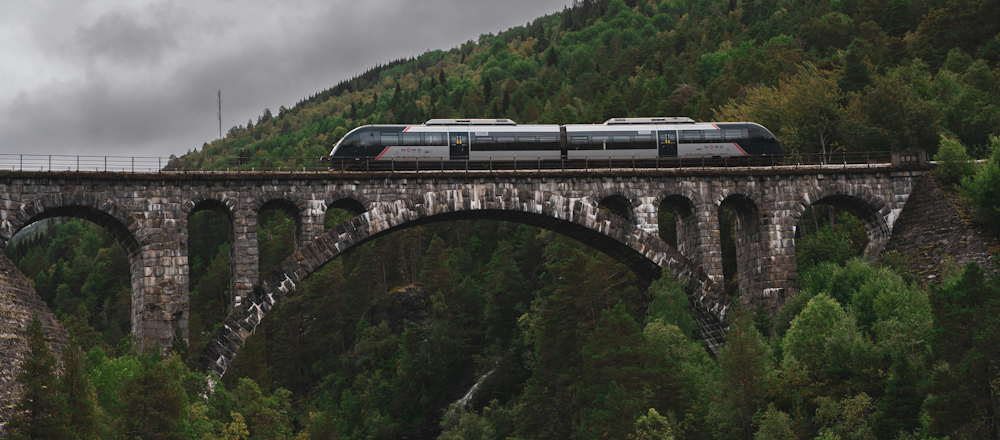 NORD Train on Kylling Bridge in Norway by Karl Paul Baldacchino on Unsplash